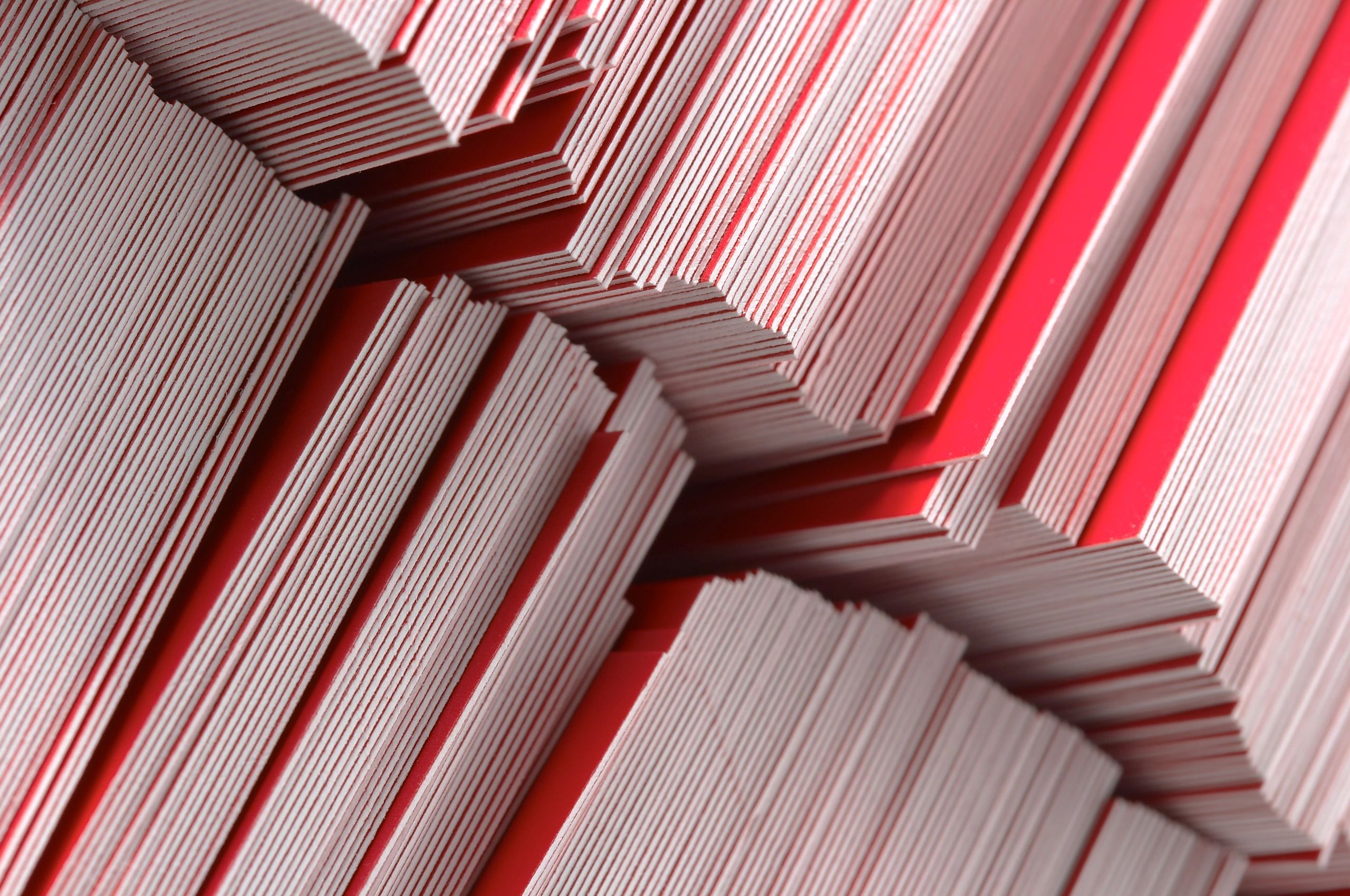 Close-up of stacked printed paper materials