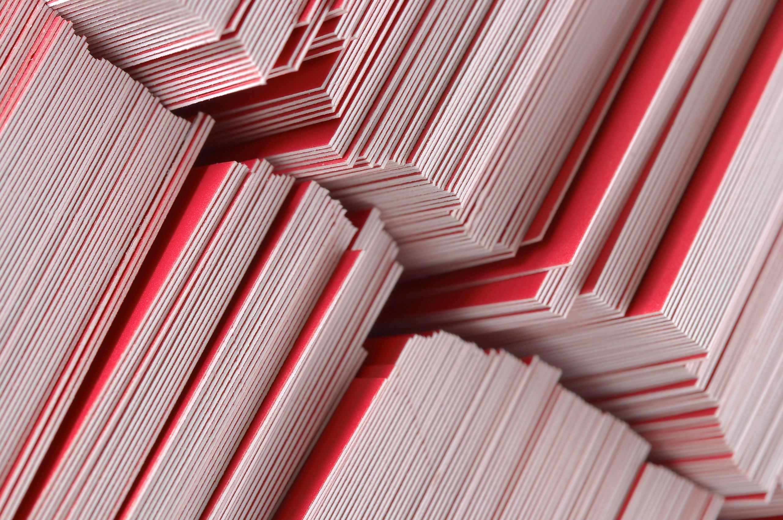 Printed paper materials stacked in close-up